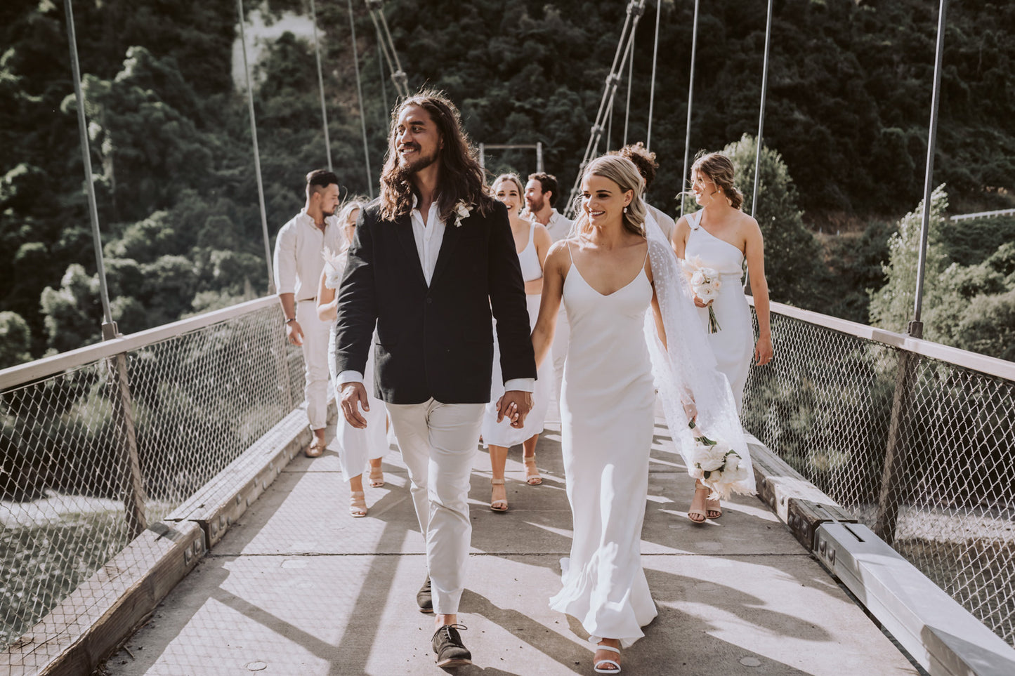 Wedding Couple Walking Across Bridge | Our favourite Wedding Vendors | The Paper Gazelle